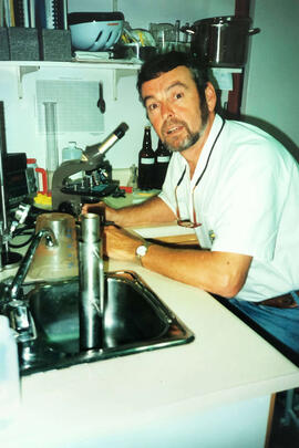 [Richard Grierson with microscope]